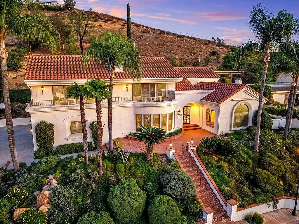 An established luxury property at dusk, reflecting Crestview's heritage in the high-end real estate market